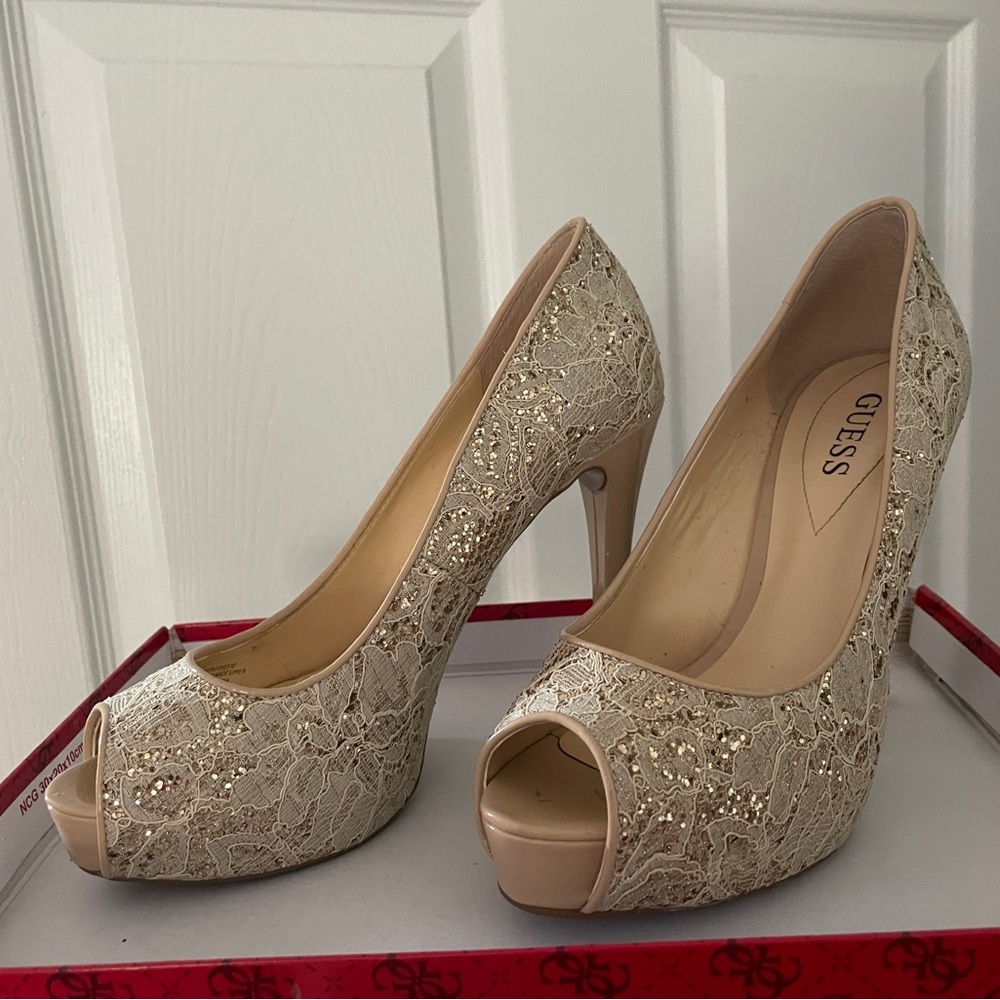 Fancy Gold/cream Guess high heeled peep toe platform heels.